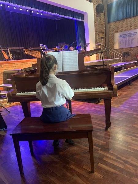 Primary school Stella Szabo captivating the audience with her piano performance at the Primary school Informal Music evening Term 1.