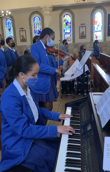 Two grade 11 musicians played the hymns in their grade mass. 