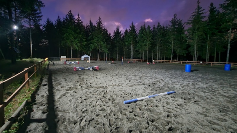 Night riding under arena lights.