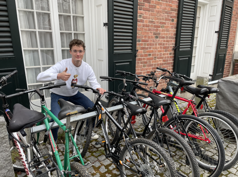 EB@Y Team Member Jacob Slaughter poses with the recently acquired bike fleet