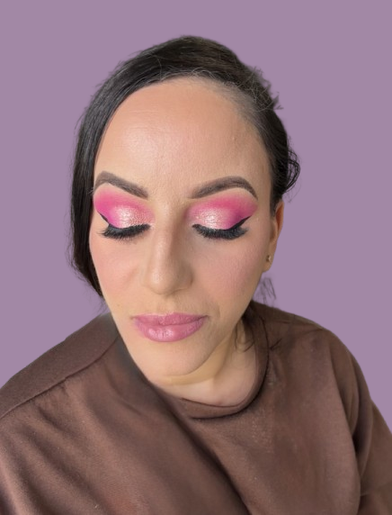 Pink dream glam — shimmer lids, bold lashes, effortless glow.