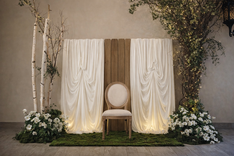 Romantic Enchanted Backdrop
A glowing ceremony backdrop featuring warm lights and lush greenery.