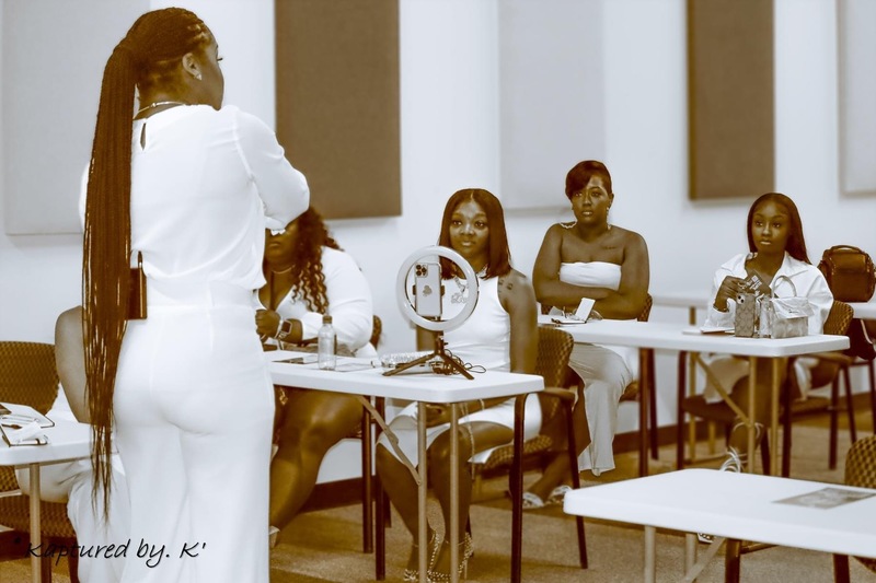 Enise Dalisma speaking to a room full of entrepreneurs at the ReviveHer Business convention held in Atlanta, Ga April 30th 2022. 